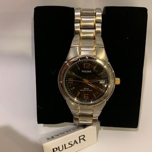 Large silver little gold black face watch